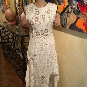 Asymmetric scalloped crochet top and skirt set.